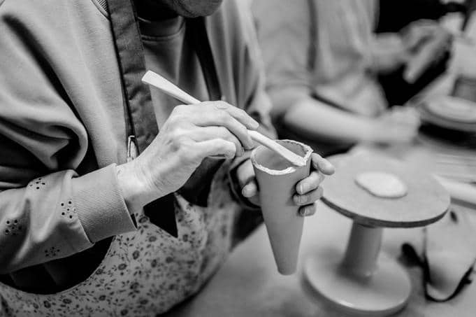 An elephant being sculpted from clay by hand