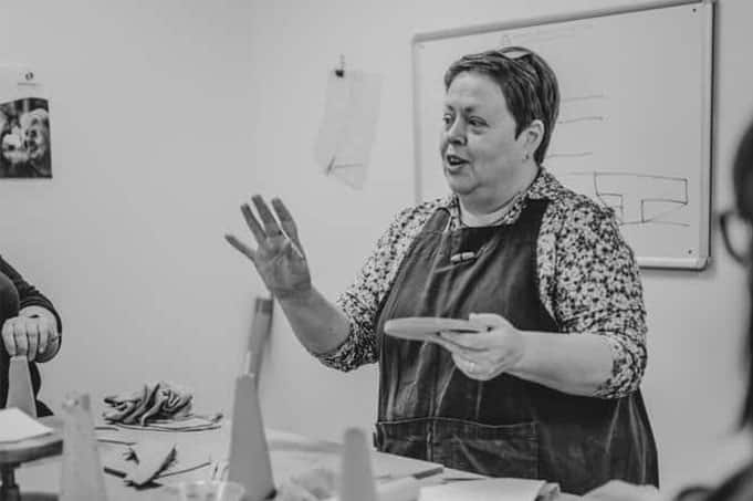 An elephant being sculpted from clay by hand